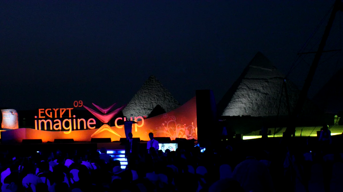 The 2009 Imagine Cup global finals stage in Cairo, with the pyramids lit behind it