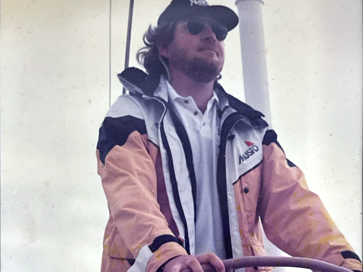 Roger Lawrence at the helm of a sailing yacht during Cowes Week